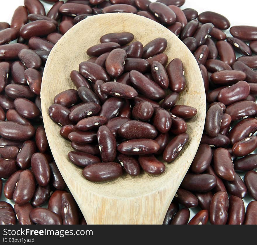 Dried red beans on a wooden spoon. Dried red beans on a wooden spoon.