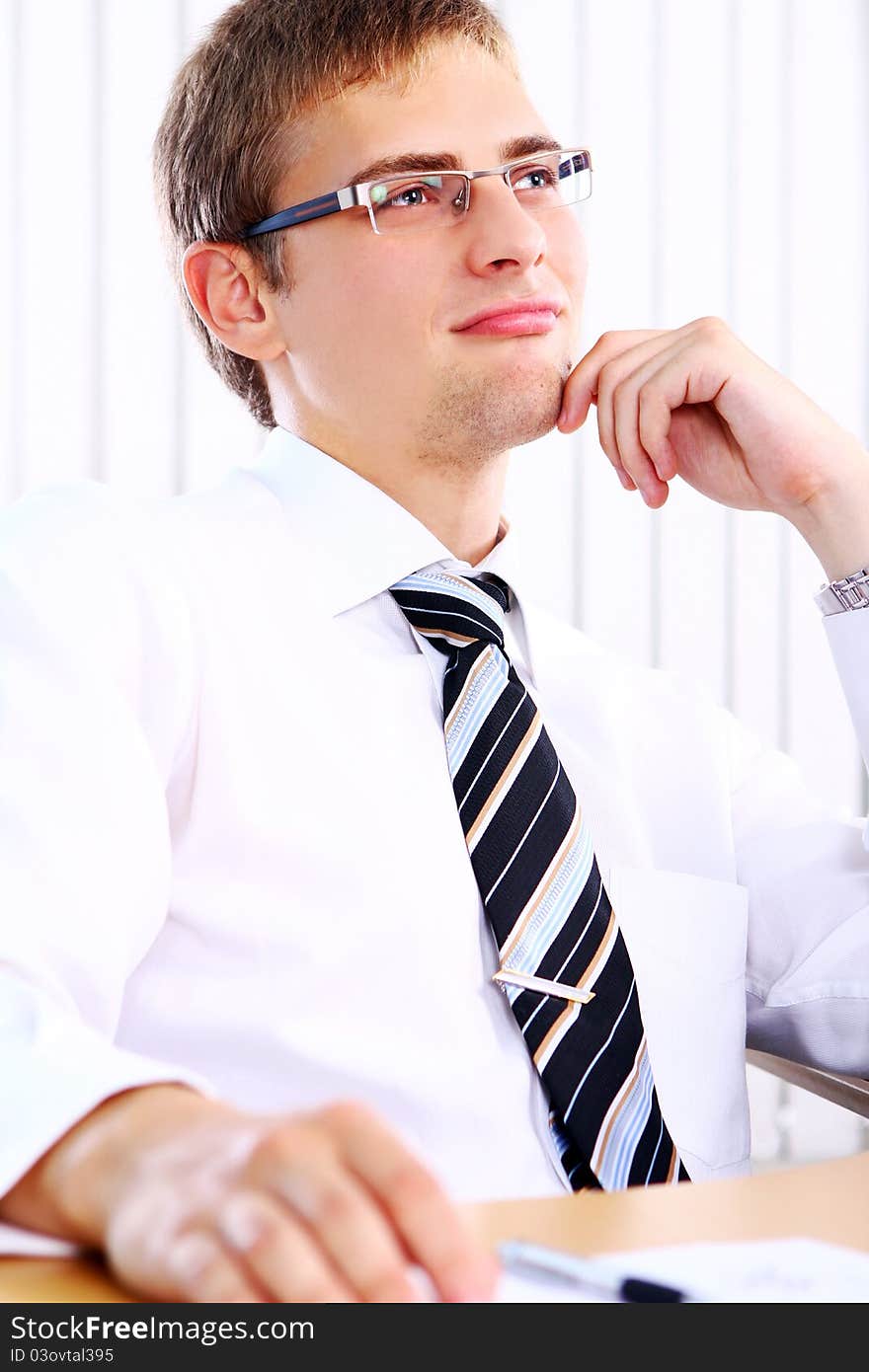 Thinking businessman in office