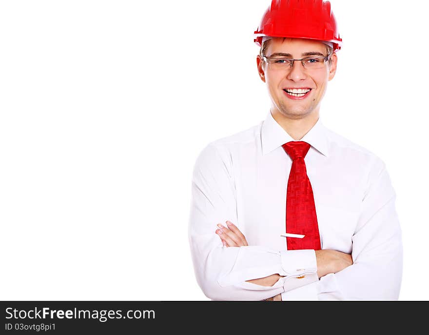 Young smiling architect in red helmet isolated over white background. Young smiling architect in red helmet isolated over white background