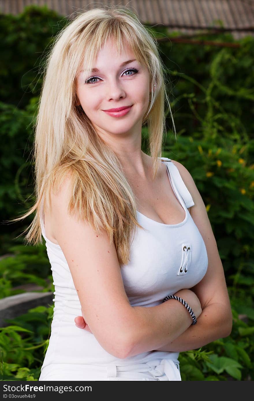 Pretty young female at natural background in the evening. Pretty young female at natural background in the evening