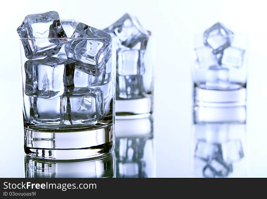 Empty glass filled with ice cubes