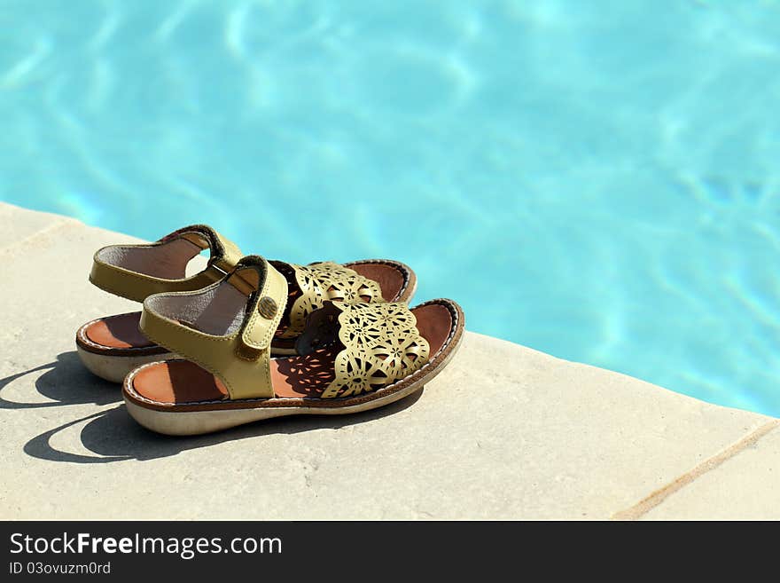 Details of sandals at poolside