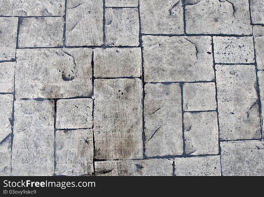 Grey background of stone texture wall in daylight