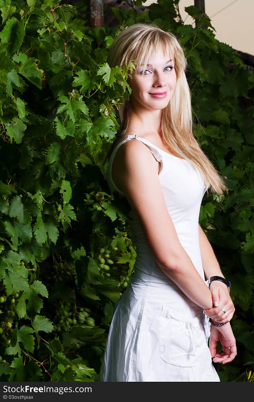 Young attractive blond girl posing outdoors