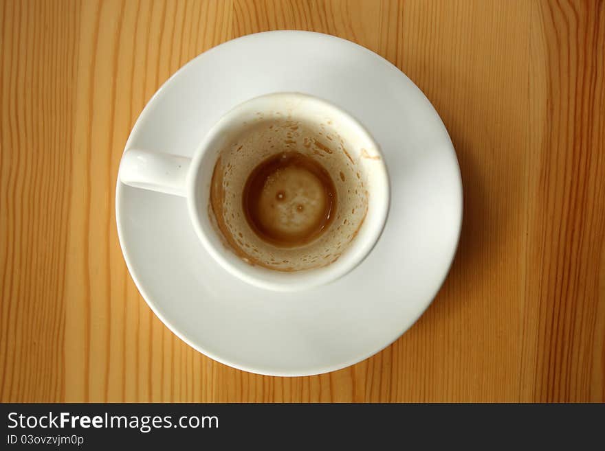 Empty white cup after espresso coffee - top view. Empty white cup after espresso coffee - top view