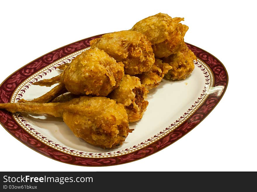 Several pieces of fried chicken leg. Arranged on the plate. Several pieces of fried chicken leg. Arranged on the plate.