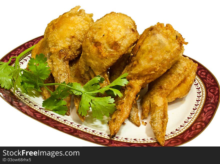 Several pieces of fried chicken leg. Arranged on the plate. Several pieces of fried chicken leg. Arranged on the plate.