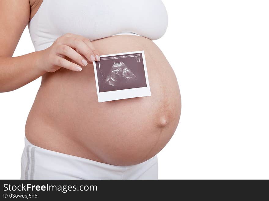 Pregnant woman hold in hand ultrasound