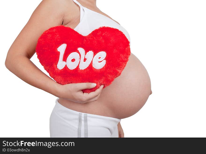 Pregnant woman hold red hart with love in hands on white background