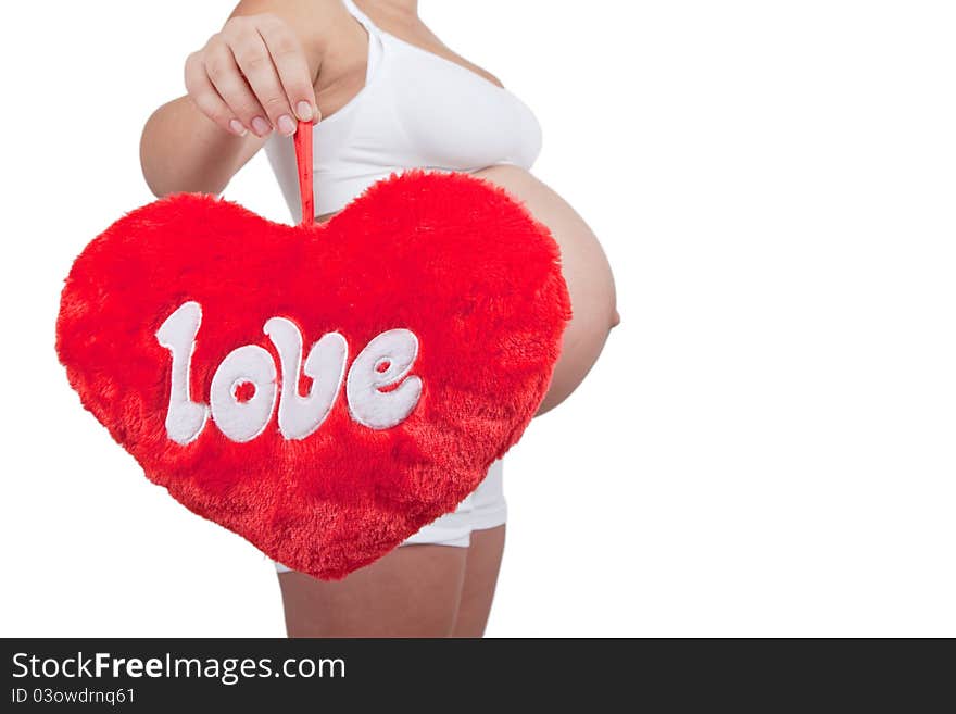 Pregnant woman hold red hart with love in hands on white background