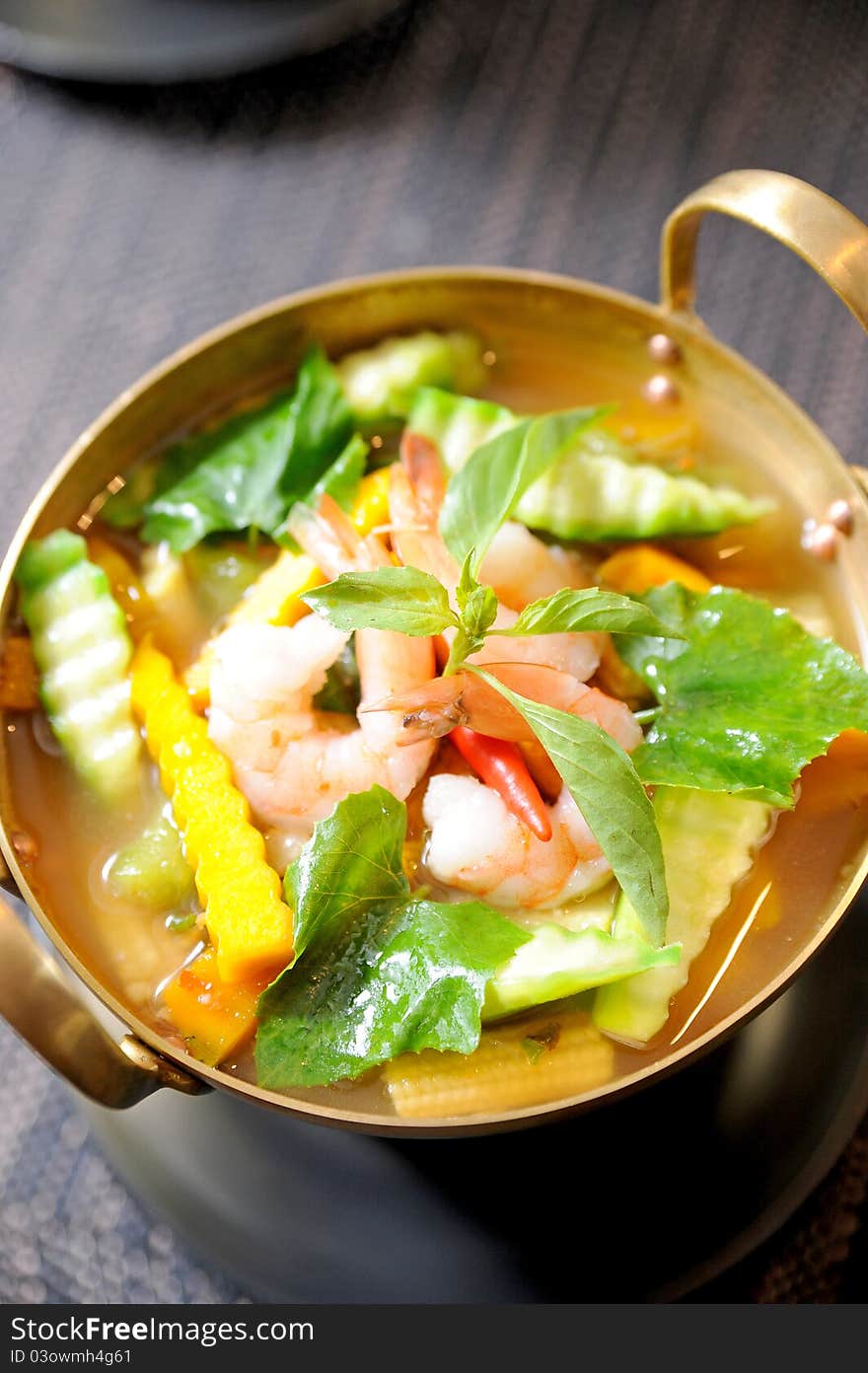 A bowl of seafood curry in thai style