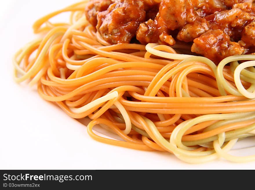 Colorful Spaghetti bolognese on a plate in close up