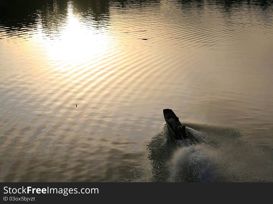 Riding boat with wave and light reflection