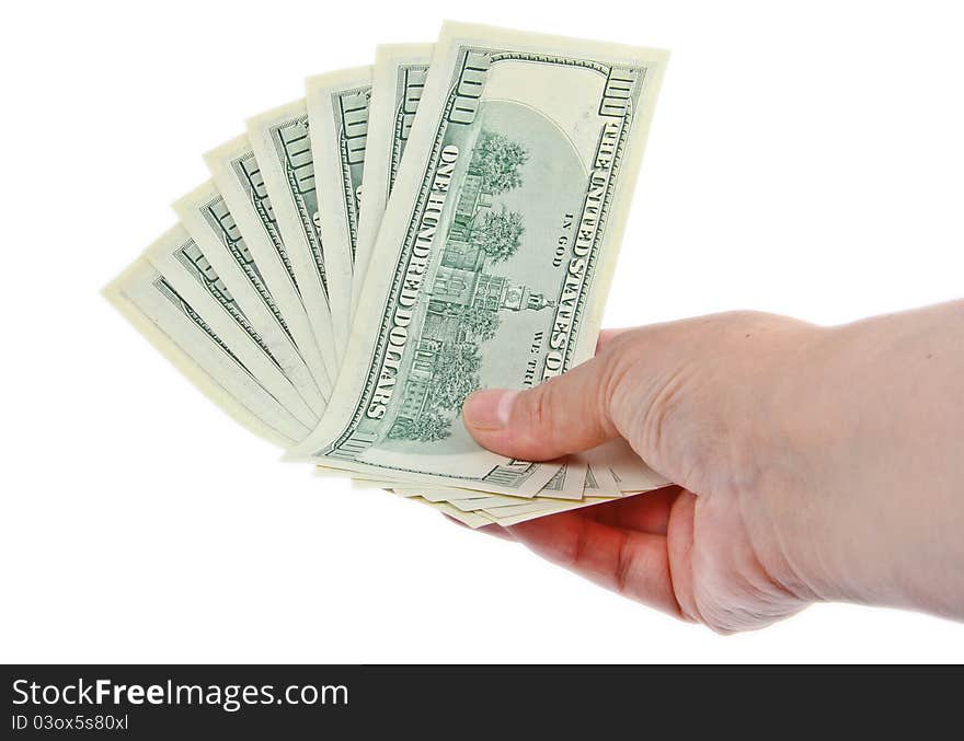 Hand holding hundred dollar notes. Close up on white background