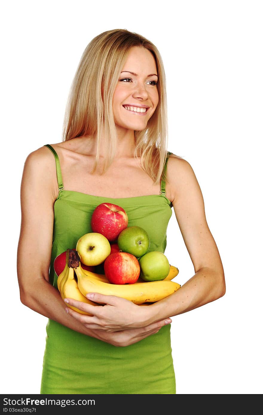 Woman holds a pile of fruit on a white background