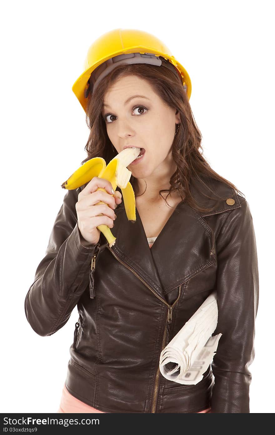 A construction worker woman getting ready to eat her fruit. A construction worker woman getting ready to eat her fruit