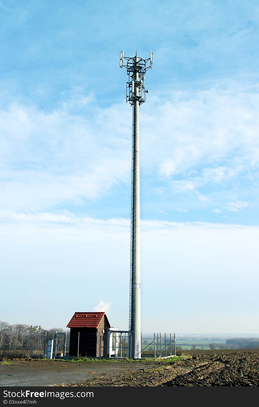 Transmitter with blue sky and clouds