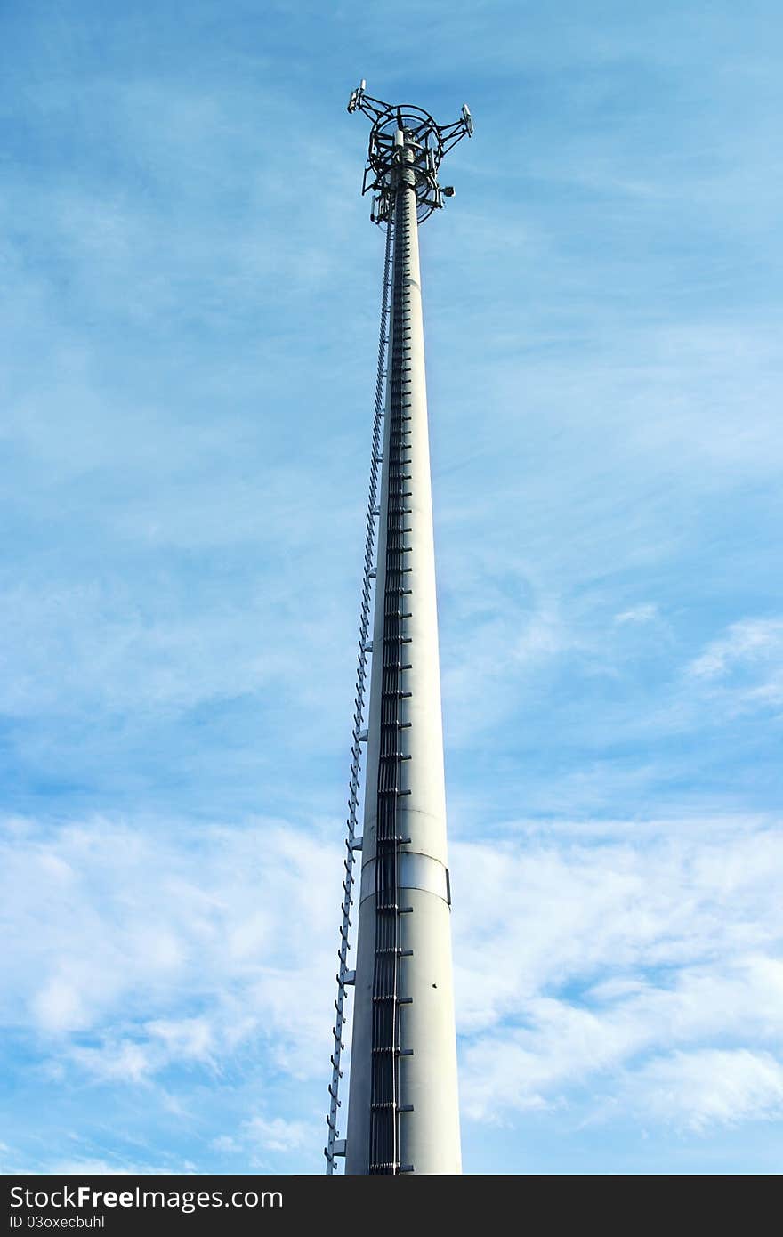 Transmitter with blue sky and clouds