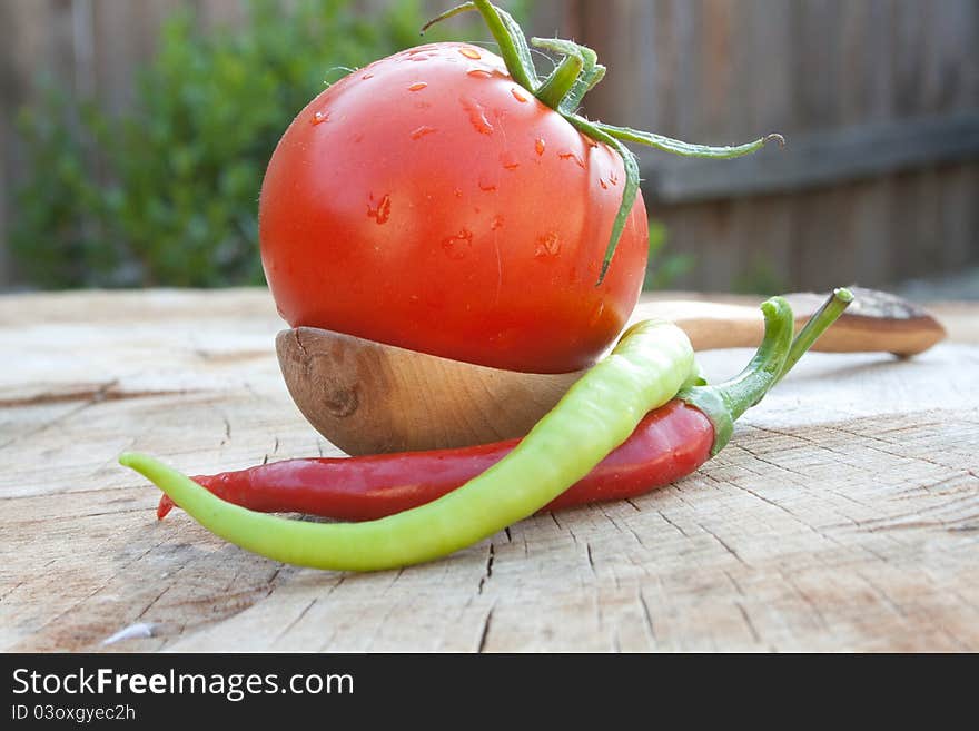 Wooden spoon tomato and hot pepper