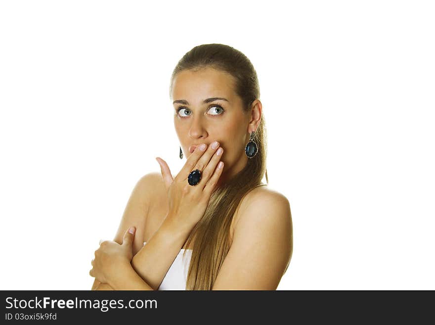 Close-up of a beautiful young woman with expensive jewelry earrings and ring. Isolated on a white background. Close-up of a beautiful young woman with expensive jewelry earrings and ring. Isolated on a white background