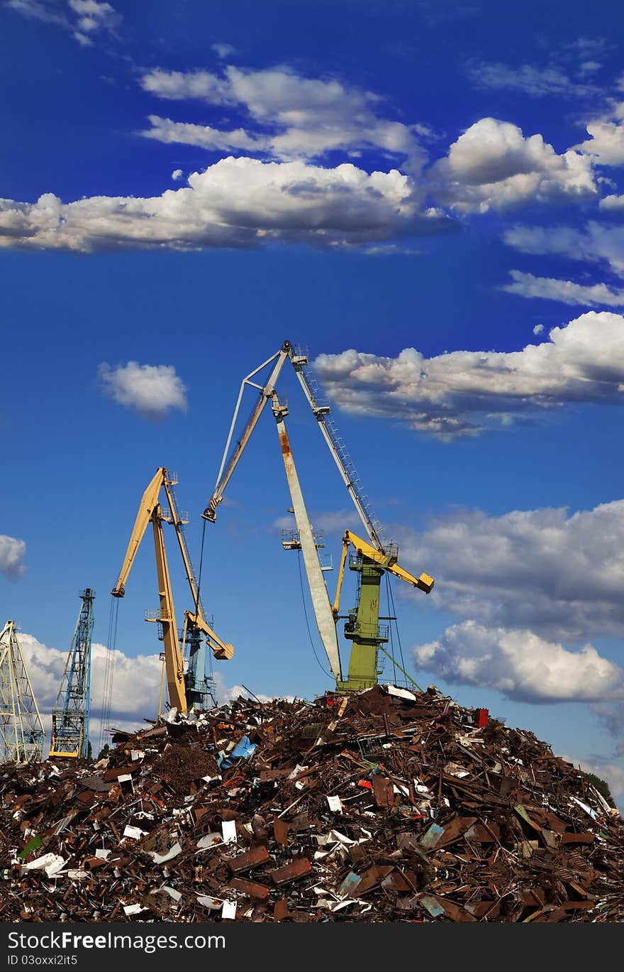 Industrial grabber crane loads the barge scrap metal. Industrial grabber crane loads the barge scrap metal