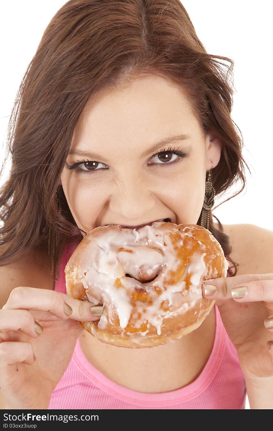 Woman close biting doughnut