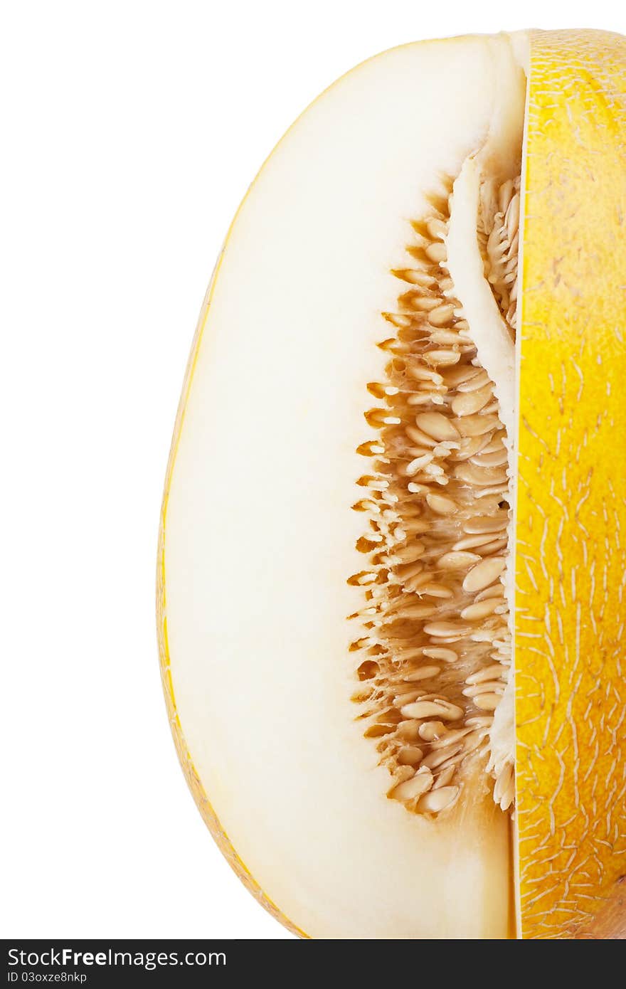 Sliced melon with many seeds over white background