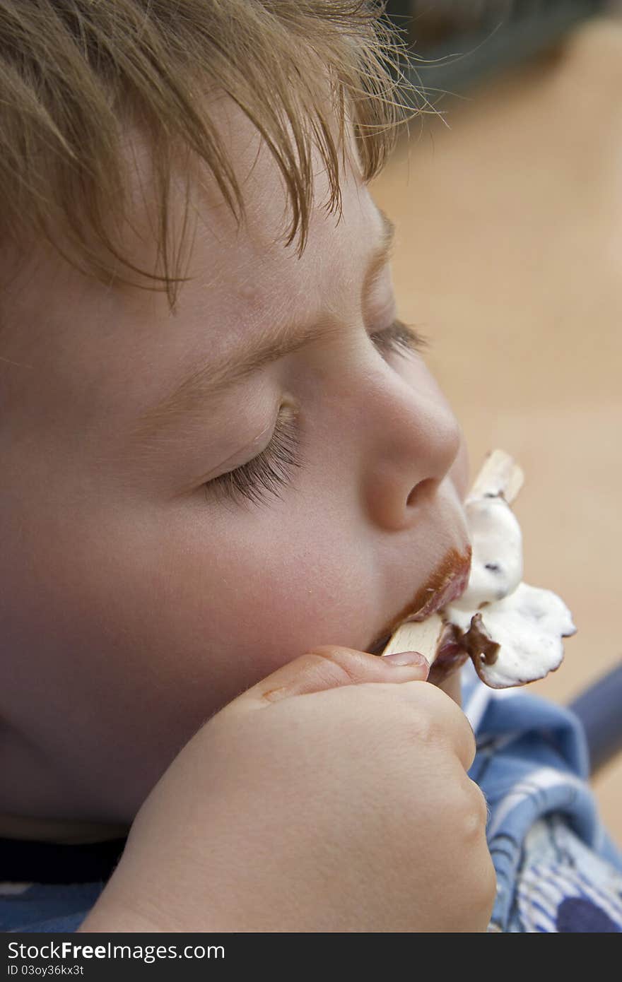 Young boy eating ice cream