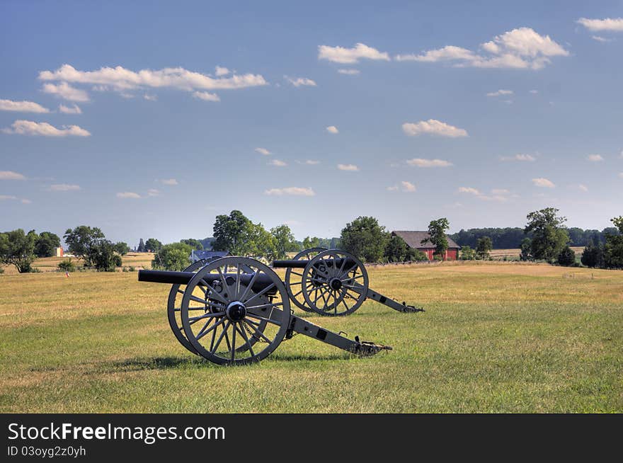 Two civil war era cannons in open field