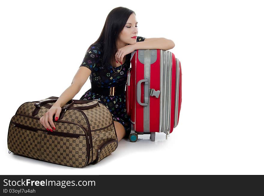 Tired girl with suitcases isolated on white. Tired girl with suitcases isolated on white