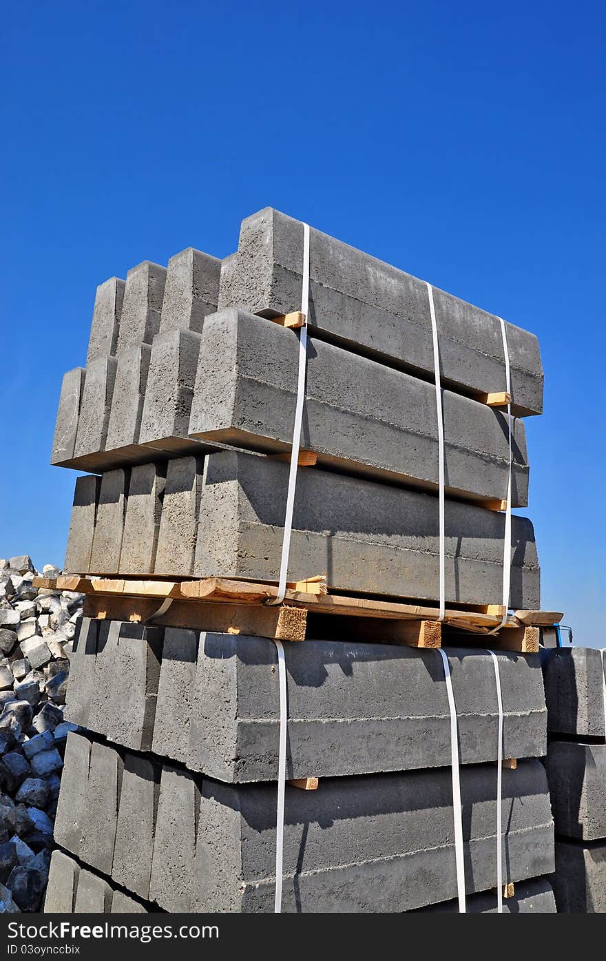 The pallet with a border on a building site against the sky.