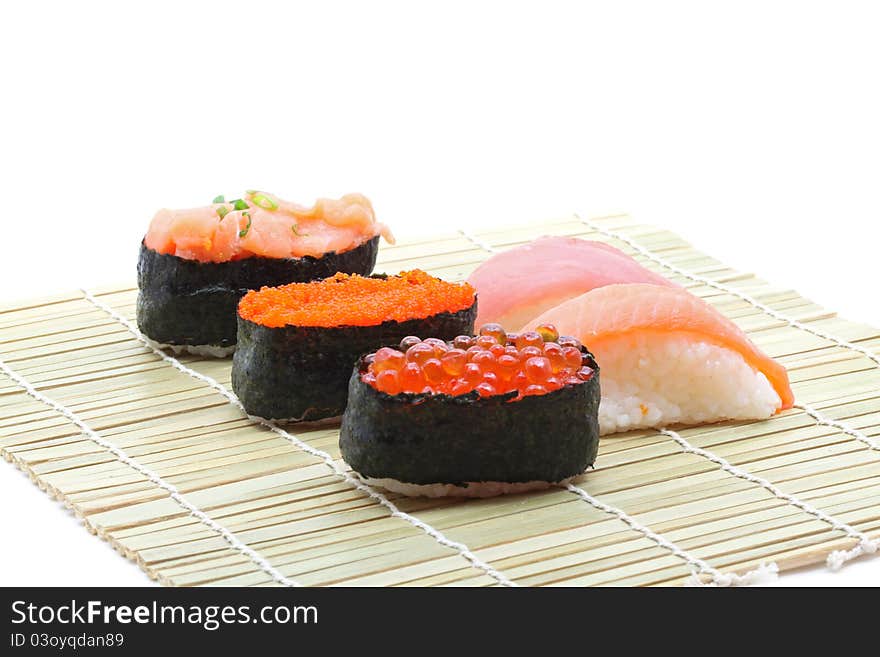 Fresh seafood sushi set on traditional bamboo dish