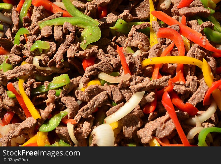 Meat and vegetables cooking on grill. Meat and vegetables cooking on grill