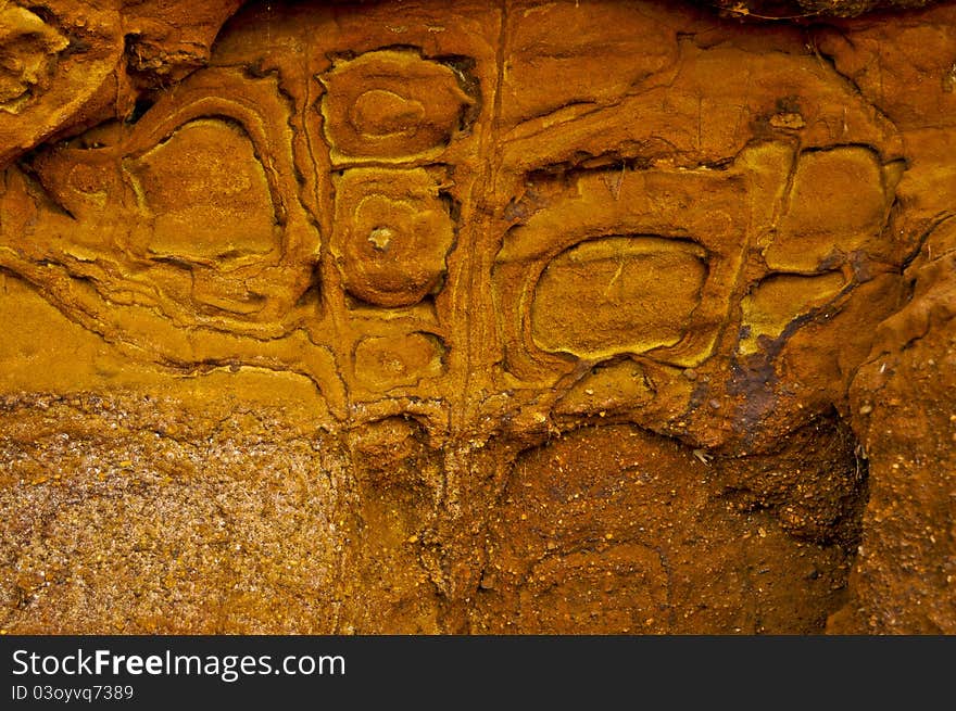 Patterned orange cliff rock face. Patterned orange cliff rock face