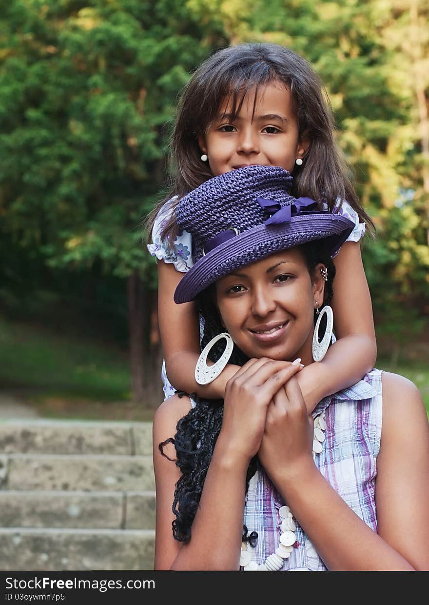 Mother and daughter in a summer day