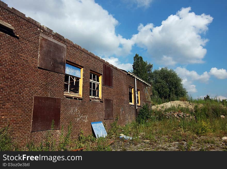 Old abandoned house over blue sky