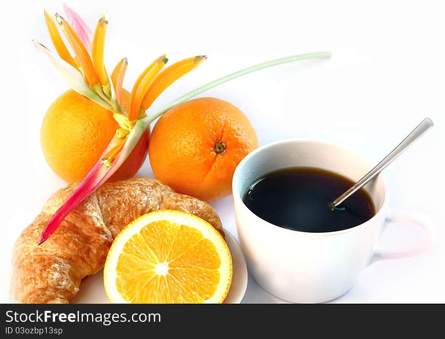 Hot coffee and croissants, orange decorate with flower. Hot coffee and croissants, orange decorate with flower