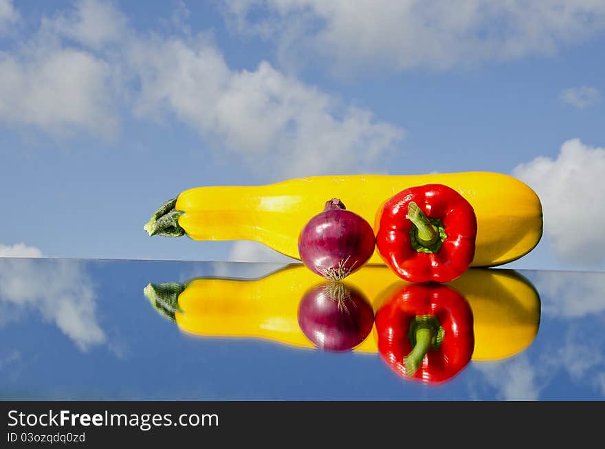 Summer Vegetables On Mirror And Sky