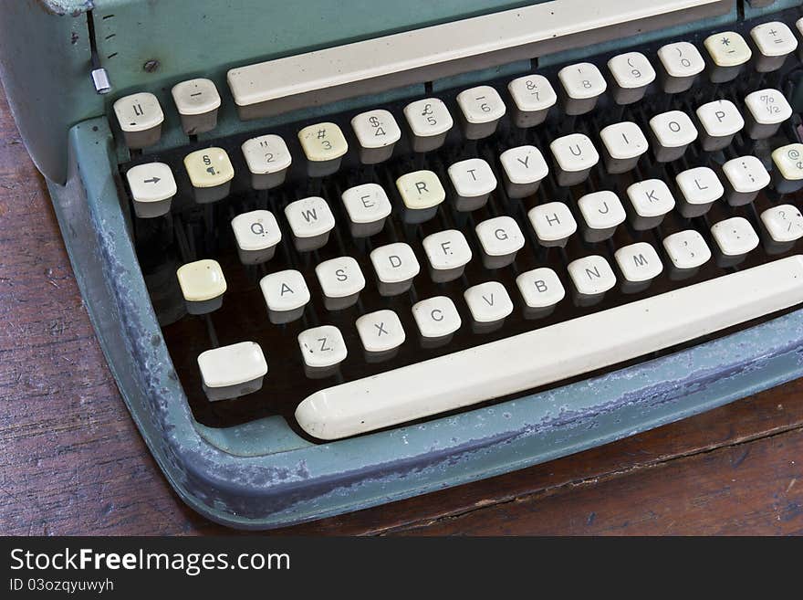 Old type device keyboard on old wooden table