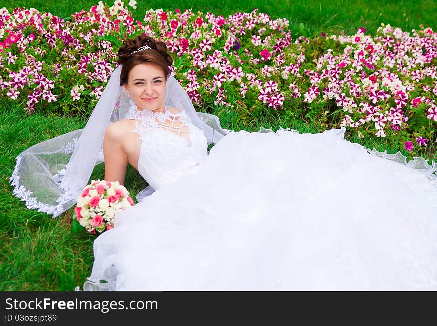 Portrait of a beautiful bride on the grass