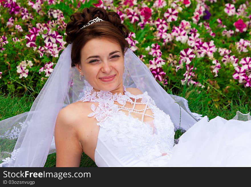 Portrait of a beautiful bride on the grass