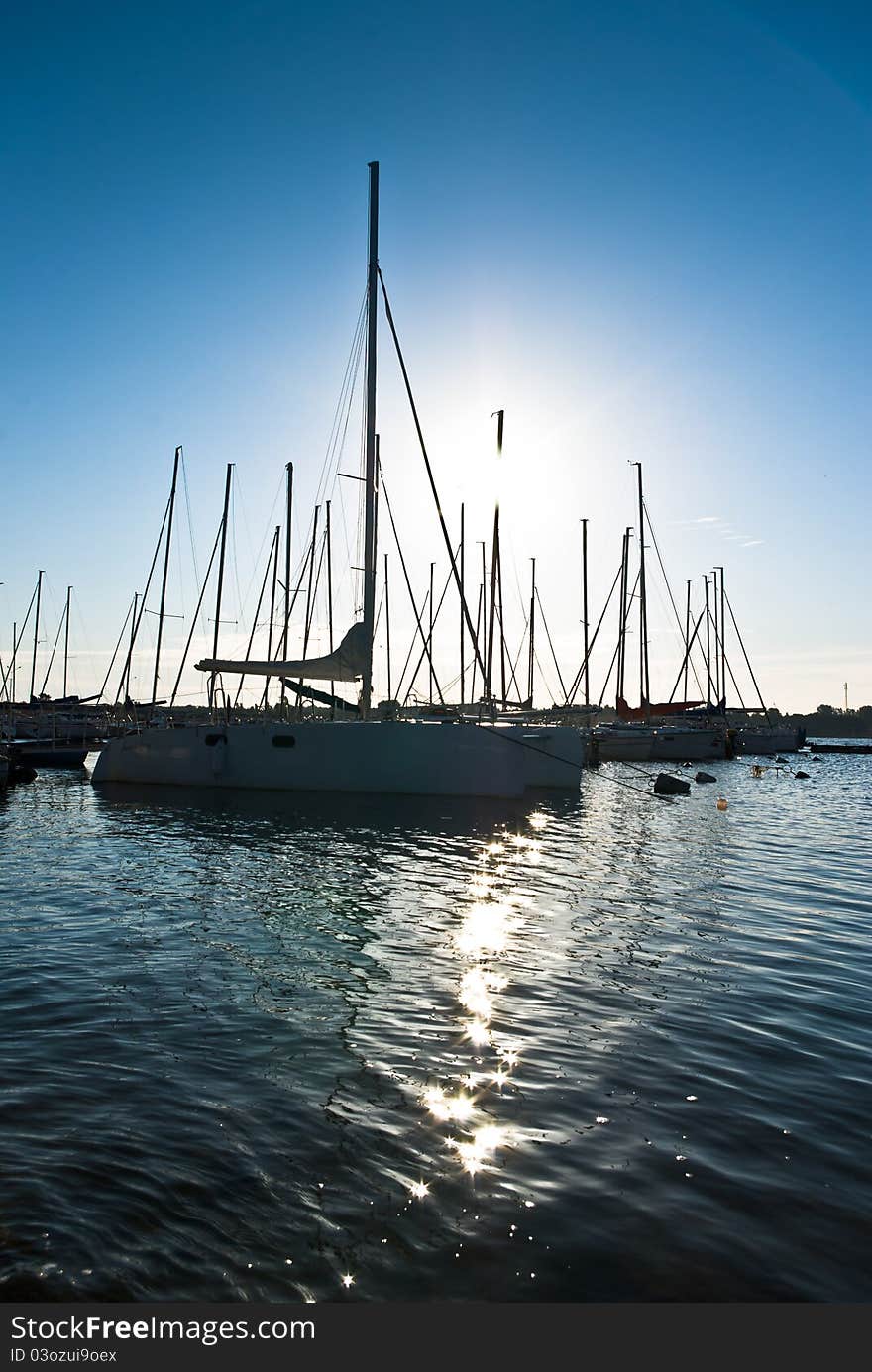 Yachts on an anchor in harbor, boats series