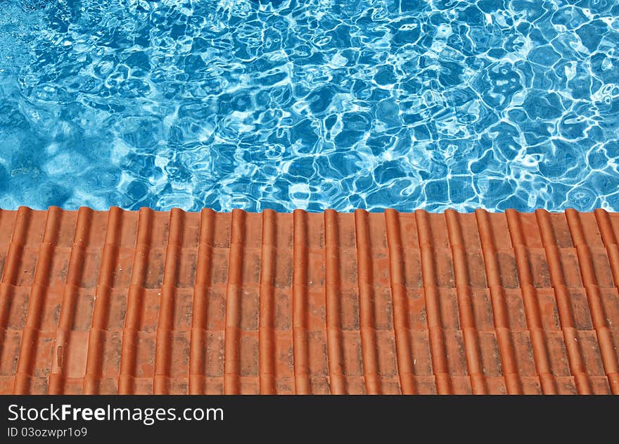 Blue water and red tiles. Blue water and red tiles