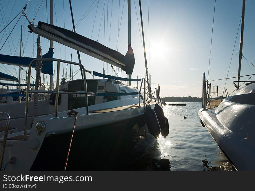 Yachts on an anchor in harbor, boats series