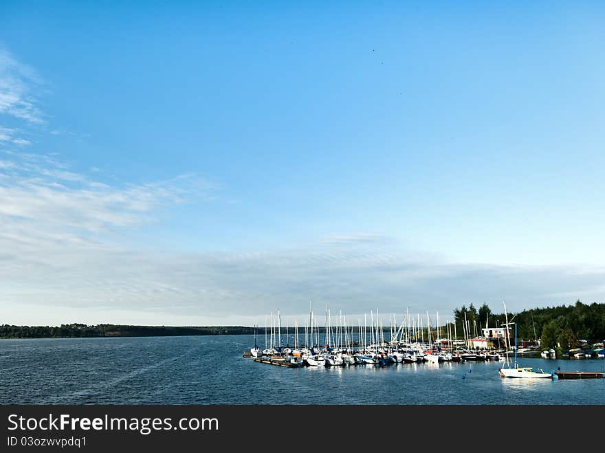 Yachts on an anchor in harbor, boats series