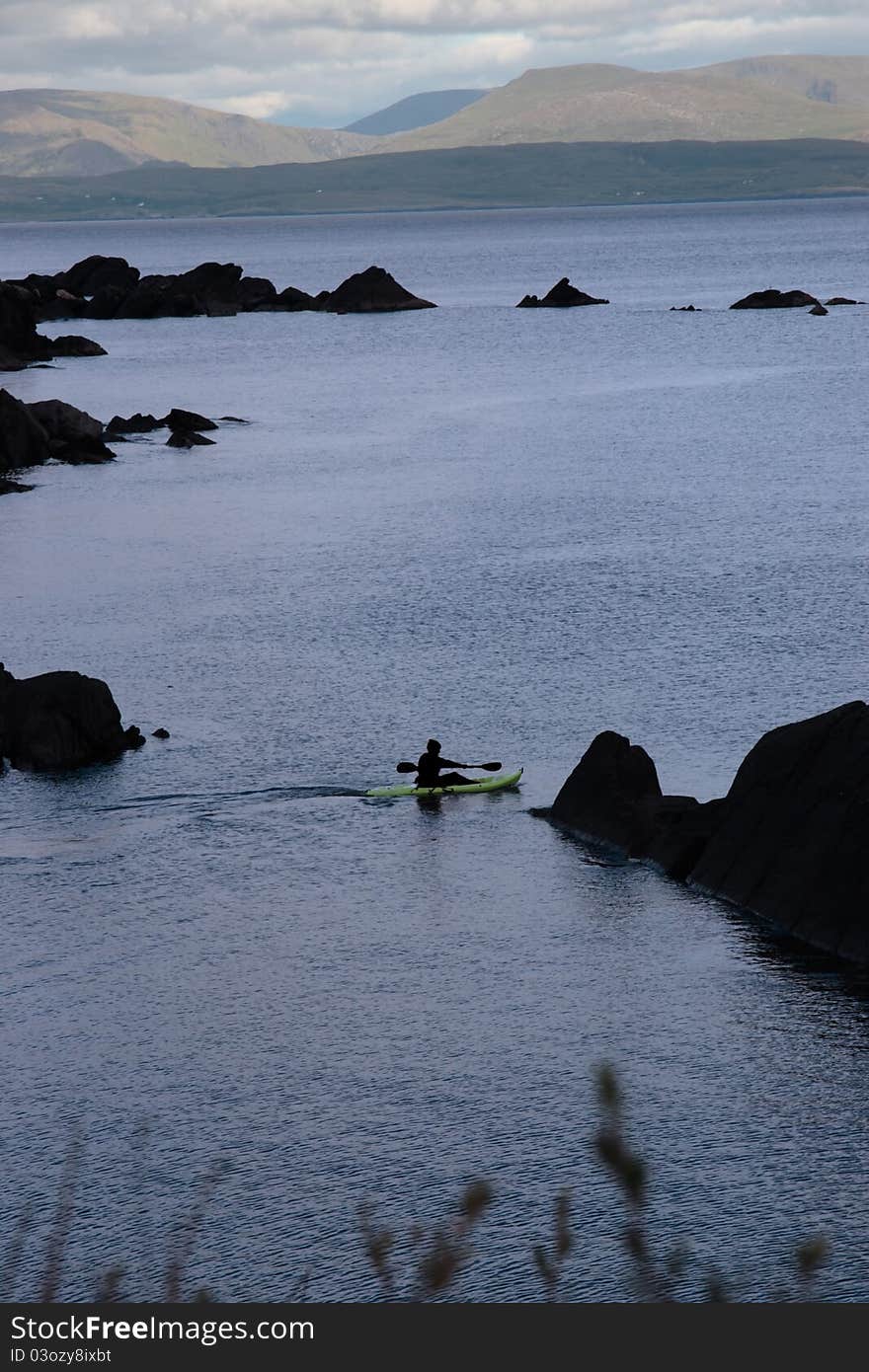 A lone kayaker on the coast of kerry in ireland