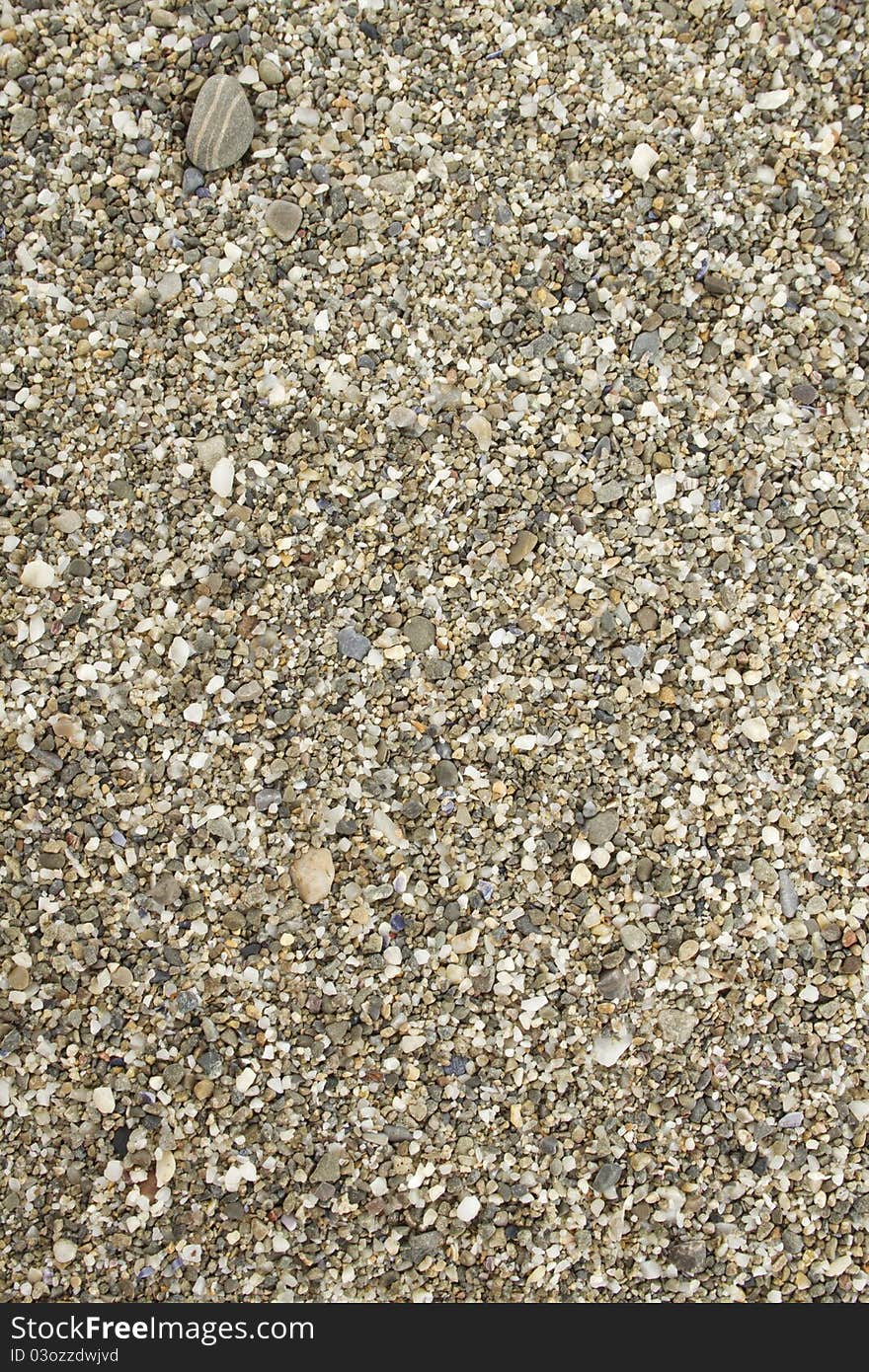 Background of small sea stones. Beach. On top. Background of small sea stones. Beach. On top