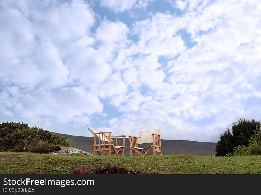 Two chairs on a hill