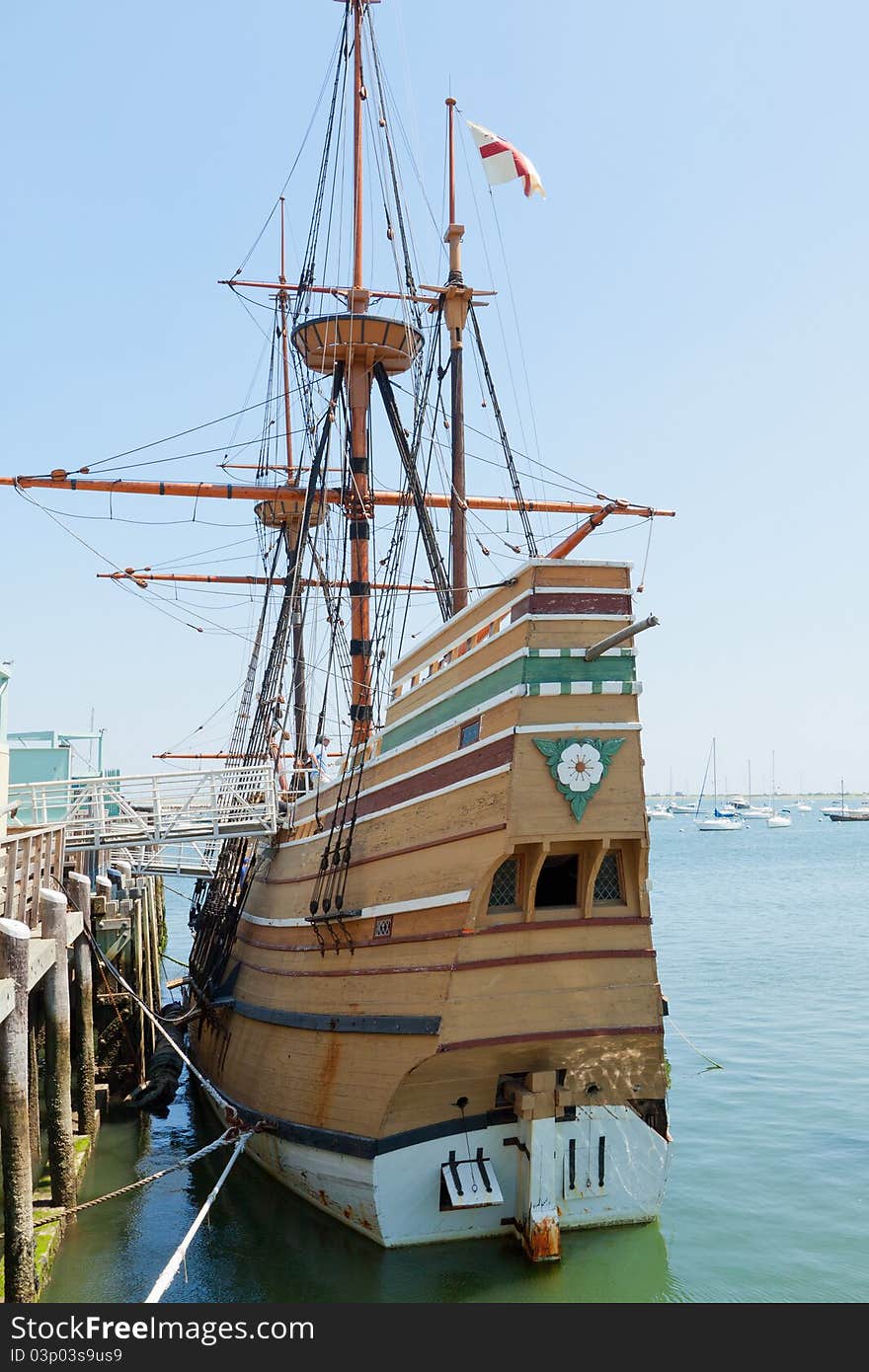 View of mast and rigging on the tall sail ship against the blue sky. View of mast and rigging on the tall sail ship against the blue sky.