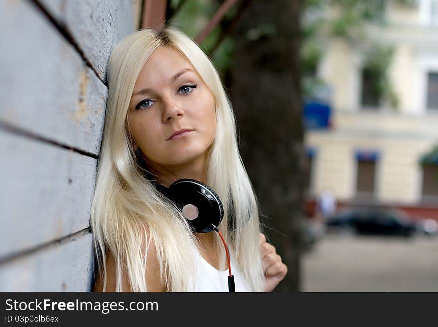 Closeup Portrait Of A Girl With Headphones